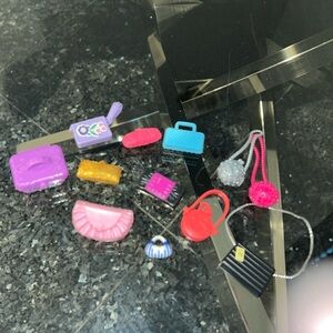 12 vintage Barbie clutch/shoulder bags.
